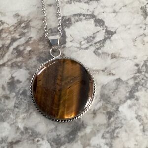 Beautiful Tiger’s Eye round Pendant with 30 inch chain.